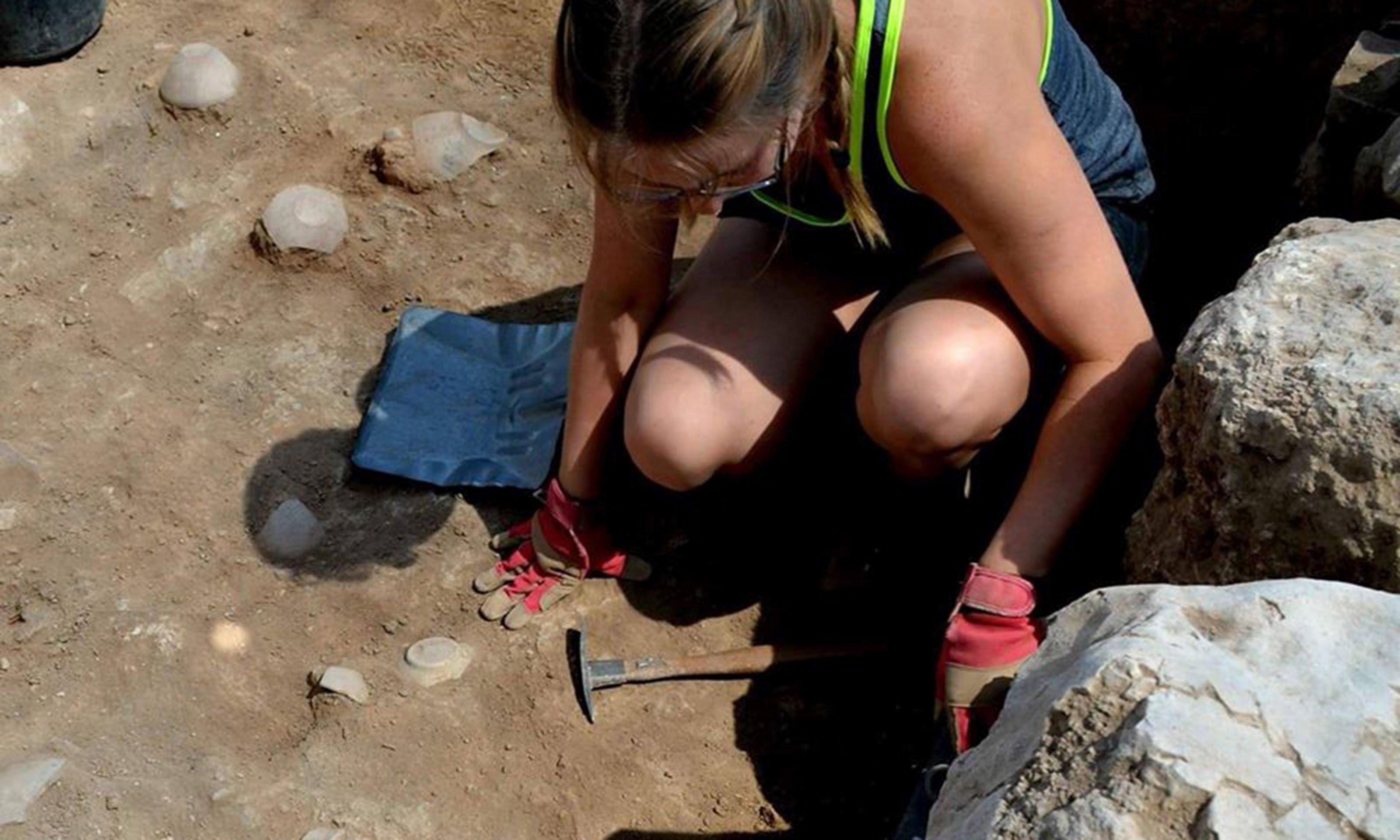 Female student digging