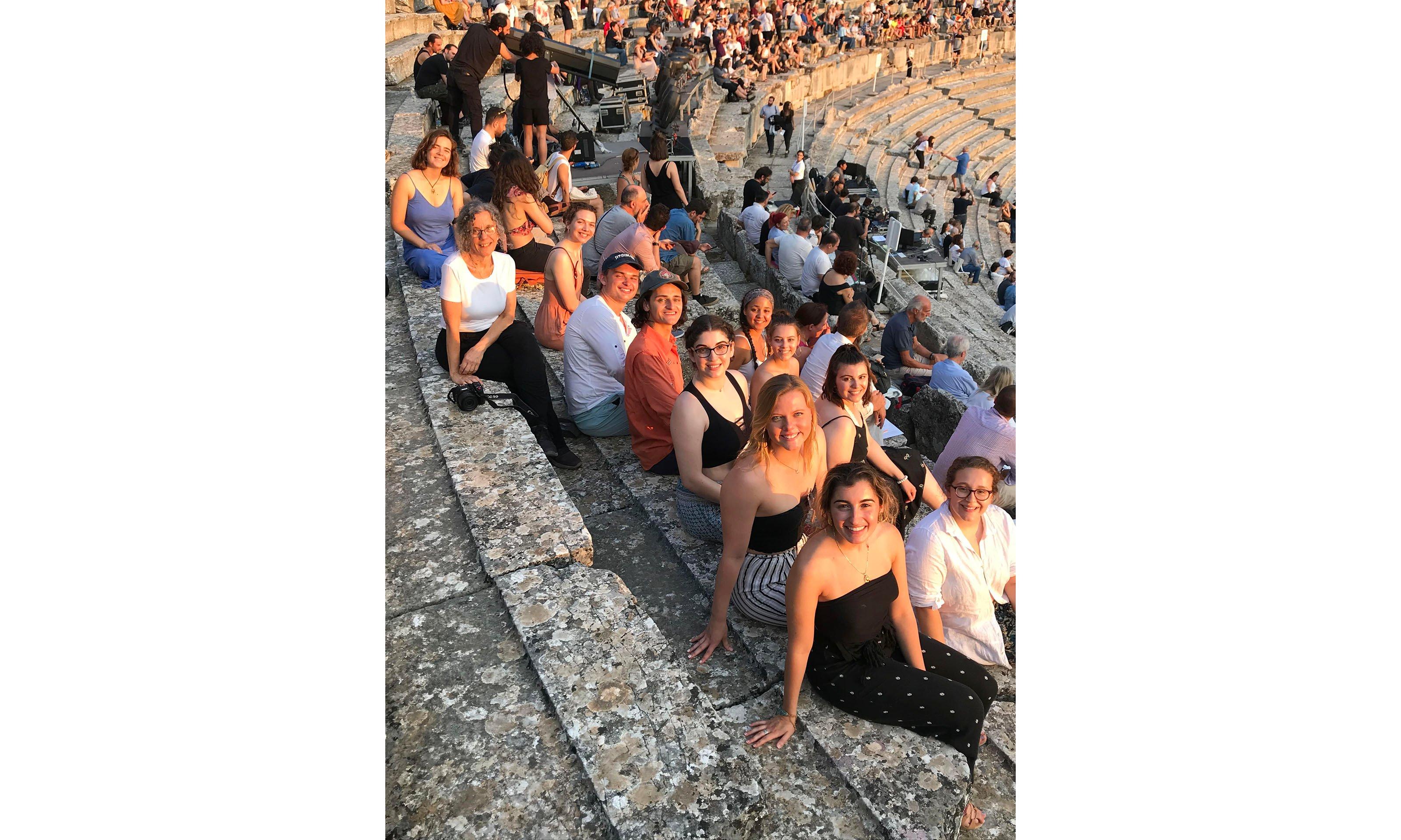 Group of students sitting in Greek stadium